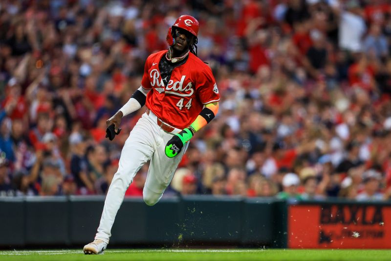 Jun 11, 2024; Cincinnati, Ohio, USA; Cincinnati Reds shortstop Elly De La Cruz (44) scores on a RBI single hit by first baseman Spencer Steer (not pictured) in the sixth inning against the Cleveland Guardians at Great American Ball Park. Mandatory Credit: Katie Stratman-USA TODAY Sports