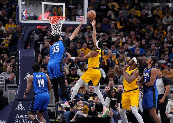 INDIANAPOLIS, INDIANA - NOVEMBER 19: Bruce Brown #11 of the Indiana Pacers shoots against Goga Bitadze #35 of the Orlando Magic during the first half of an NBA basketball game at Gainbridge Fieldhouse on November 19, 2023 in Indianapolis, Indiana. NOTE TO USER: User expressly acknowledges and agrees that, by downloading and or using this photograph, User is consenting to the terms and conditions of the Getty Images License Agreement. (Photo by Jeff Dean/Getty Images)