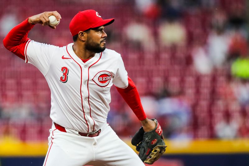 Apr 23, 2024; Cincinnati, Ohio, USA; Cincinnati Reds third baseman Jeimer Candelario (3) throws to first to get Philadelphia Phillies third baseman Edmundo Sosa (not pictured) out in the second inning at Great American Ball Park. Mandatory Credit: Katie Stratman-USA TODAY Sports