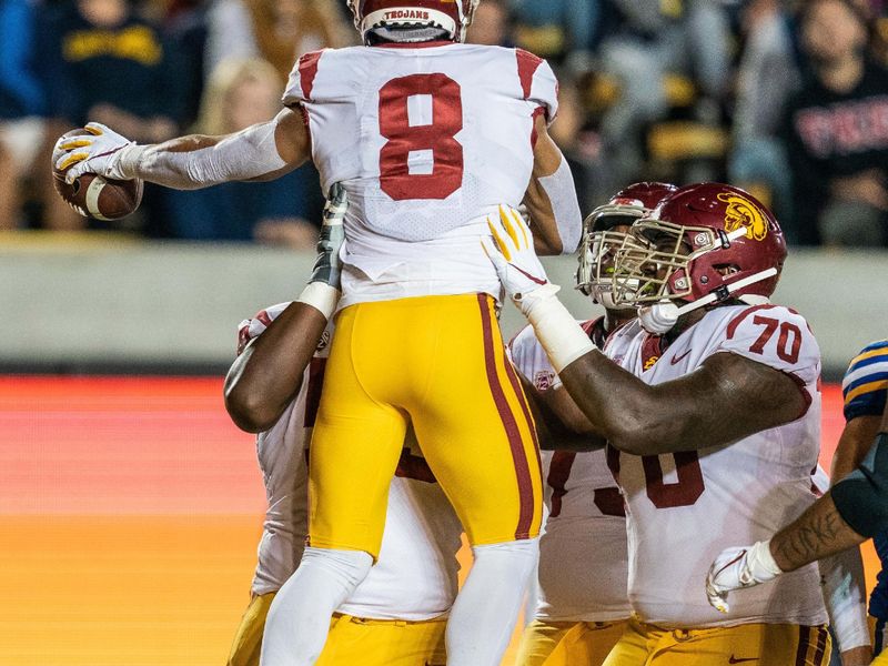 Nov 16, 2019; Berkeley, CA, USA; USC Trojans offensive tackle Drew Richmond (53) lifts wide receiver Amon-Ra St. Brown (8) to celebrate after the touchdown during the first quarter against the California Golden Bears  at California Memorial Stadium. Mandatory Credit: Neville E. Guard-USA TODAY Sports