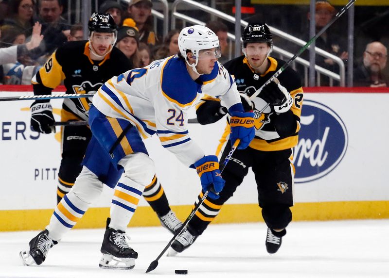 Jan 6, 2024; Pittsburgh, Pennsylvania, USA;  Buffalo Sabres center Dylan Cozens (24) moves the puck against the Pittsburgh Penguins during the third period at PPG Paints Arena. Buffalo won 3-1. Mandatory Credit: Charles LeClaire-USA TODAY Sports