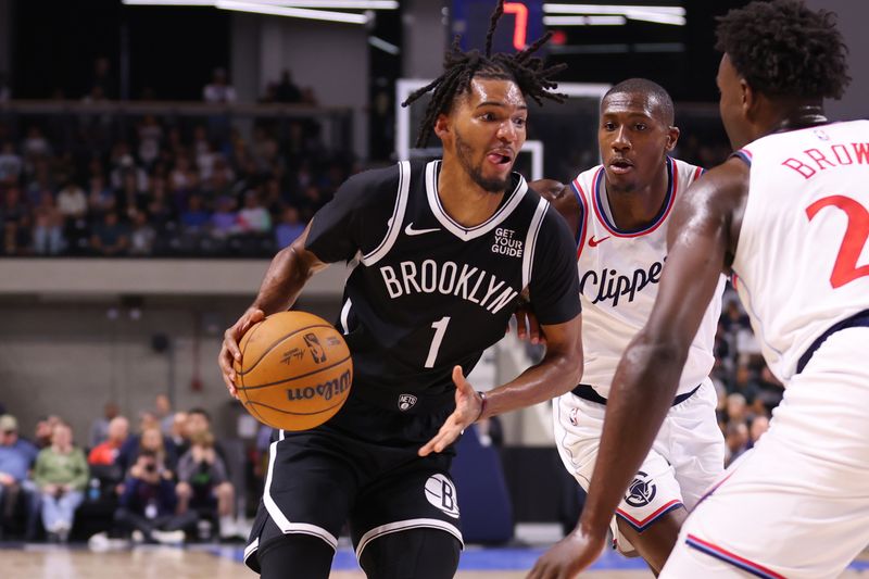 OCEANSIDE, CALIFORNIA - OCTOBER 08: Ziaire Williams #1 of the Brooklyn Nets defends against Kris Dunn #8 of the Los Angeles Clippers in the third quarter at Frontwave Arena on October 08, 2024 in Oceanside, California. NOTE TO USER: User expressly acknowledges and agrees that, by downloading and or using this photograph, User is consenting to the terms and conditions of the Getty Images License Agreement. (Photo by Joe Scarnici/Getty Images)