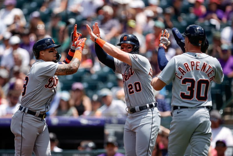 Jul 2, 2023; Denver, Colorado, USA; Detroit Tigers shortstop Javier Baez (28) celebrates his grand slam with first baseman Spencer Torkelson (20) and designated hitter Zach McKinstry (39) and right fielder Kerry Carpenter (30) in the first inning against the Colorado Rockies at Coors Field. Mandatory Credit: Isaiah J. Downing-USA TODAY Sports