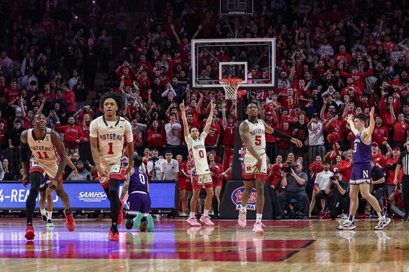 Feb 15, 2024; Piscataway, New Jersey, USA; Rutgers Scarlet Knights guard Jamichael Davis (1) and center Clifford Omoruyi (11) and guard Derek Simpson (0) and forward Aundre Hyatt (5) celebrates in front of Northwestern Wildcats guard Brooks Barnhizer (13) at the end of the game at Jersey Mike's Arena. Mandatory Credit: Vincent Carchietta-USA TODAY Sports