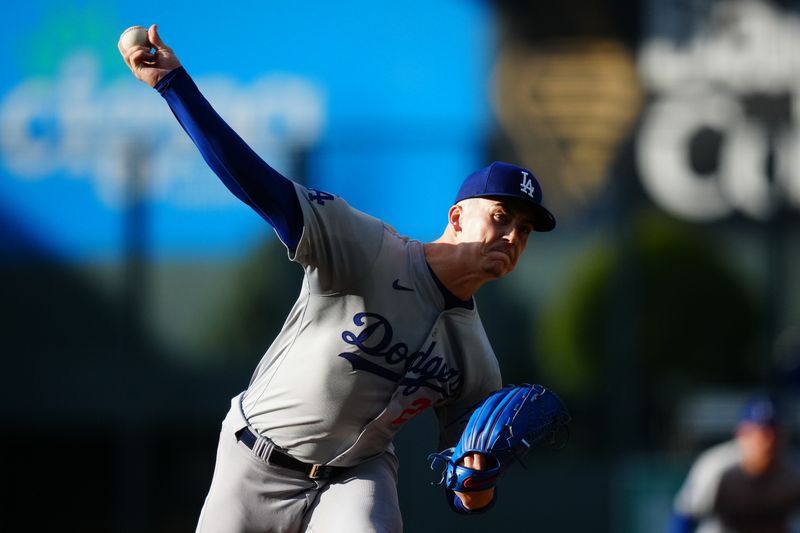 Jun 19, 2024; Denver, Colorado, USA; Los Angeles Dodgers starting pitcher Bobby Miller (28) delivers a pitch in the first inning against the Colorado Rockies at Coors Field. Mandatory Credit: Ron Chenoy-USA TODAY Sports