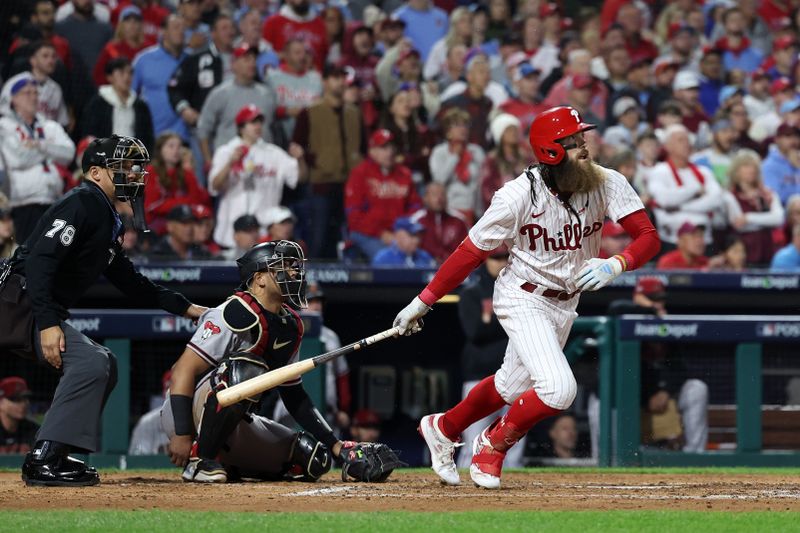 Oct 24, 2023; Philadelphia, Pennsylvania, USA; Philadelphia Phillies center fielder Brandon Marsh (16) hits a single in the second inning for game seven of the NLCS for the 2023 MLB playoffs at Citizens Bank Park. Mandatory Credit: Bill Streicher-USA TODAY Sports