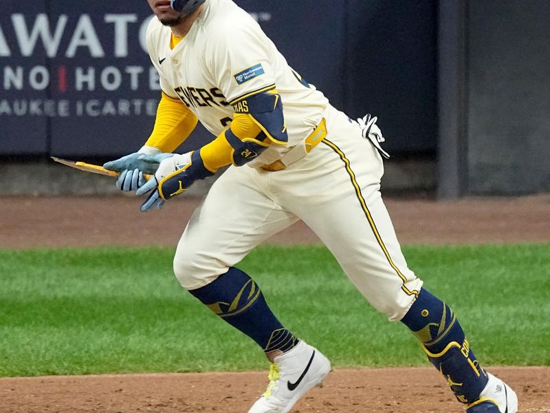 May 13, 2024; Milwaukee, Wisconsin, USA;  Milwaukee Brewers catcher William Contreras (24) hits a broken bat single during the third inning of their game against the Pittsburgh Pirates at American Family Field. Mandatory Credit: Mark Hoffman-USA TODAY Sports