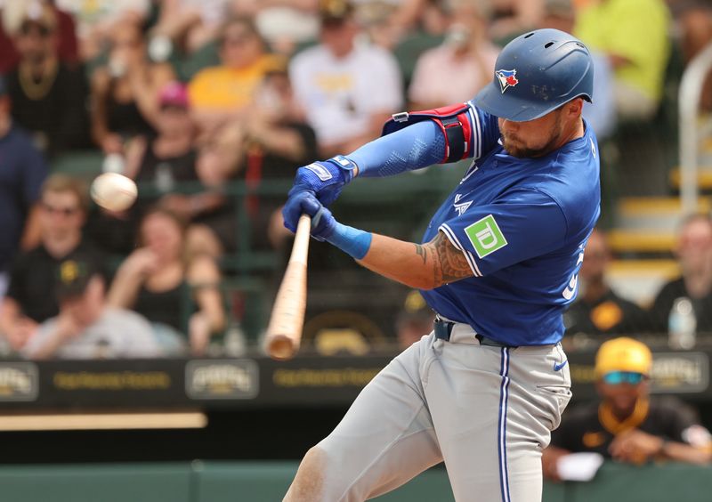 Mar 5, 2024; Bradenton, Florida, USA;  Toronto Blue Jays right fielder Nathan Lukes (38) hits a RBI double during the fifth inning against the Pittsburgh Pirates at LECOM Park. Mandatory Credit: Kim Klement Neitzel-USA TODAY Sports