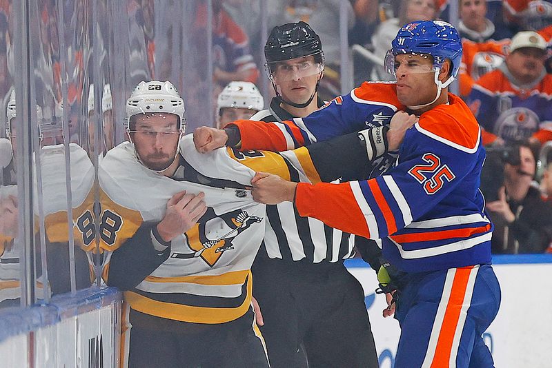 Oct 25, 2024; Edmonton, Alberta, CAN; Edmonton Oilers defensemen Darnell Nurse (25) fights Pittsburgh Penguins defensemen Marcus Pettersson (28) during the third period at Rogers Place. Mandatory Credit: Perry Nelson-Imagn Images