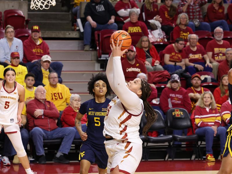 Jan 11, 2026; Ames, Iowa, USA; West Virginia Mountaineers guard Sydney Shaw (5) watches Iowa State Cyclones center Audi Crooks (55) score during the second half at James H. Hilton Coliseum. Mandatory Credit: Reese Strickland-Imagn Images