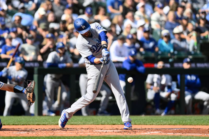 Sep 17, 2023; Seattle, Washington, USA; Los Angeles Dodgers designated hitter J.D. Martinez (28) hits a single against the Seattle Mariners during the third inning at T-Mobile Park. Mandatory Credit: Steven Bisig-USA TODAY Sports