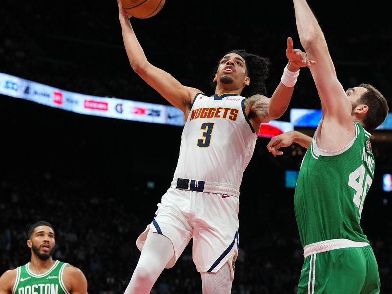 ABU DHABI, UAE - OCTOBER 6: Julian Strawther #3 of the Denver Nuggets drives to the basket during the game against the Boston Celtics during the 2024 Global Games on October 6, 2024 at the Etihad Arena in Abu Dhabi, United Arab Emirates. NOTE TO USER: User expressly acknowledges and agrees that, by downloading and/or using this Photograph, user is consenting to the terms and conditions of the Getty Images License Agreement. Mandatory Copyright Notice: Copyright 2024 NBAE (Photo by Garrett Ellwood/NBAE via Getty Images)