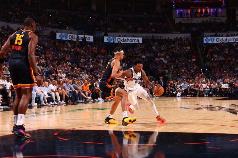 OKLAHOMA CITY, OK - APRIL 14:  Brandon Williams #00 of the Dallas Mavericks dribbles the ball during the game against the Oklahoma City Thunder on April 14, 2024 at Paycom Arena in Oklahoma City, Oklahoma. NOTE TO USER: User expressly acknowledges and agrees that, by downloading and or using this photograph, User is consenting to the terms and conditions of the Getty Images License Agreement. Mandatory Copyright Notice: Copyright 2024 NBAE (Photo by Zach Beeker/NBAE via Getty Images)