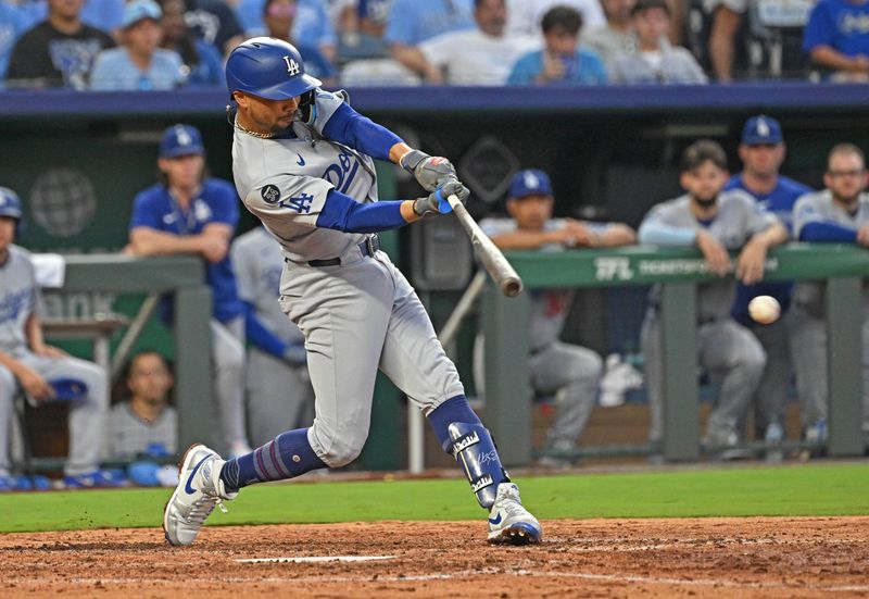 Jun 27, 2025; Kansas City, Missouri, USA; Los Angeles Dodgers shortstop Mookie Betts (50) singles in a run in the fifth inning against the Kansas City Royals at Kauffman Stadium. Mandatory Credit: Peter Aiken-Imagn Images