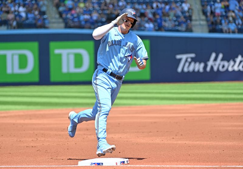 Jun 1, 2023; Toronto, Ontario, CAN;  Toronto Blue Jays third baseman Matt Chapman (26) salutes as he rounds third base after hitting a two run home run against the Milwaukee Brewers in the first inning at Rogers Centre. Mandatory Credit: Dan Hamilton-USA TODAY Sports