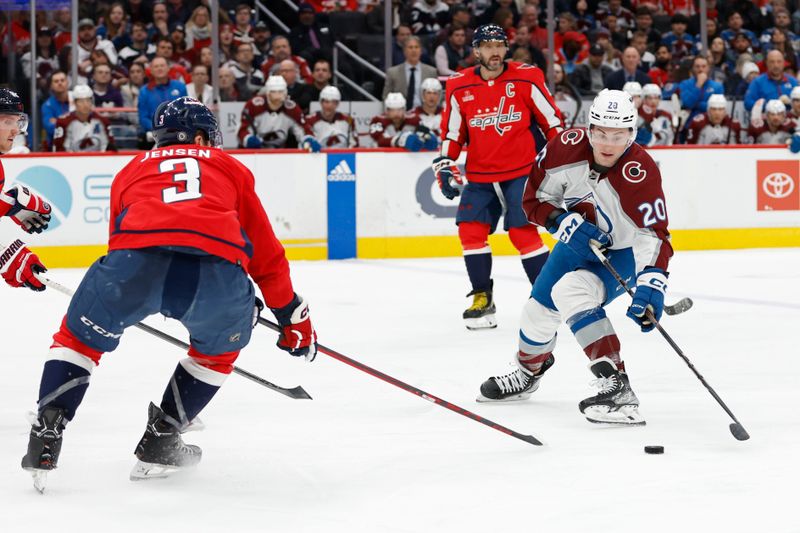 Feb 13, 2024; Washington, District of Columbia, USA; Colorado Avalanche center Ross Colton (20) skates with the puck as Washington Capitals defenseman Nick Jensen (3) in the second period at Capital One Arena. Mandatory Credit: Geoff Burke-USA TODAY Sports