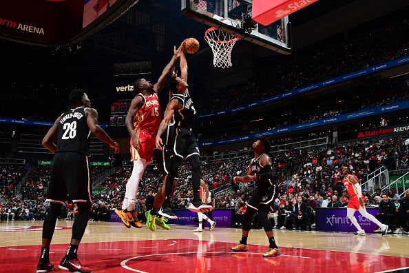 ATLANTA, GA - DECEMBER 6: Nicolas Claxton #33 of the Brooklyn Nets grabs the rebound during the game against the Atlanta Hawks on December 6, 2023 at State Farm Arena in Atlanta, Georgia.  NOTE TO USER: User expressly acknowledges and agrees that, by downloading and/or using this Photograph, user is consenting to the terms and conditions of the Getty Images License Agreement. Mandatory Copyright Notice: Copyright 2023 NBAE (Photo by Scott Cunningham/NBAE via Getty Images)