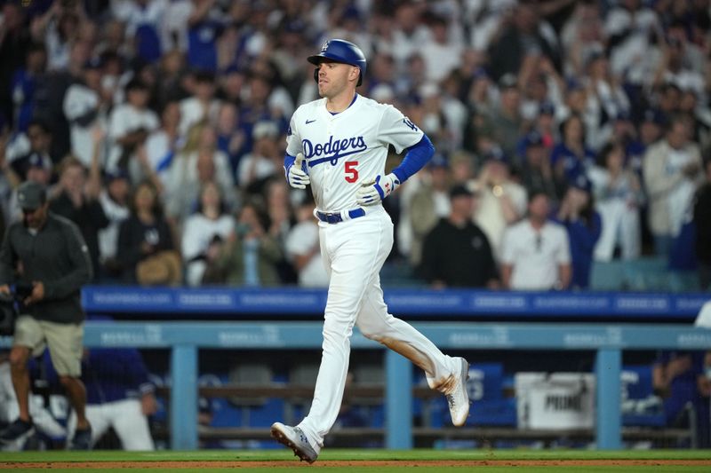 Jun 11, 2024; Los Angeles, California, USA; Los Angeles Dodgers first baseman Freddie Freeman (5) runs the bases after hitting a home run in the sixth inning against the Texas Rangers at Dodger Stadium. Mandatory Credit: Kirby Lee-USA TODAY Sports