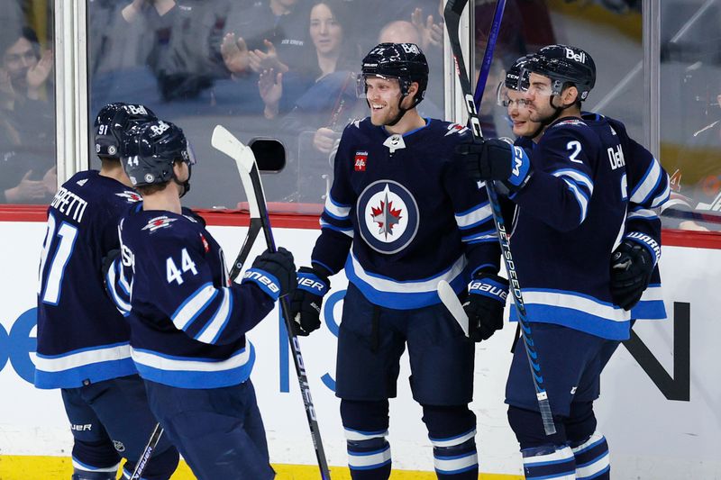 Oct 30, 2023; Winnipeg, Manitoba, CAN; Winnipeg Jets left wing Nikolaj Ehlers (27) celebrates his third period goal against the New York Rangers at Canada Life Centre. Mandatory Credit: James Carey Lauder-USA TODAY Sports