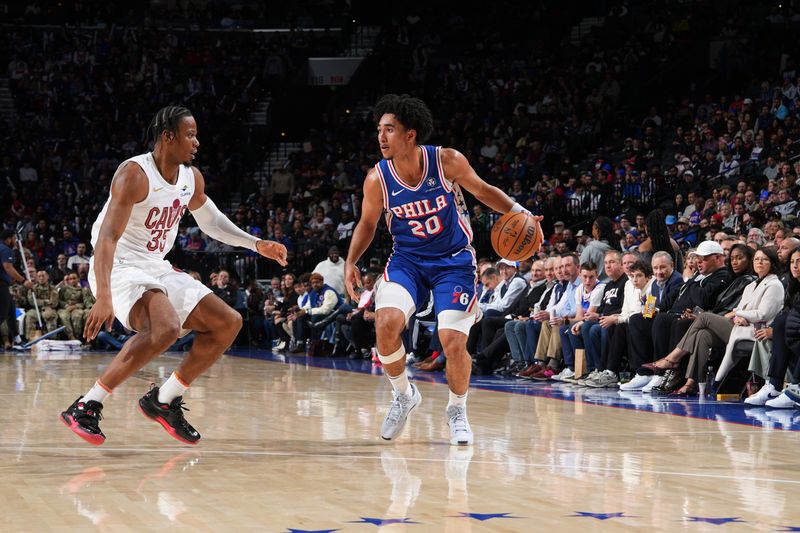 PHILADELPHIA, PA - NOVEMBER 13: Jared McCain #20 of the Philadelphia 76ers dribbles the ball during the game against the Cleveland Cavaliers on November 13, 2024 at the Wells Fargo Center in Philadelphia, Pennsylvania NOTE TO USER: User expressly acknowledges and agrees that, by downloading and/or using this Photograph, user is consenting to the terms and conditions of the Getty Images License Agreement. Mandatory Copyright Notice: Copyright 2024 NBAE (Photo by Jesse D. Garrabrant/NBAE via Getty Images)