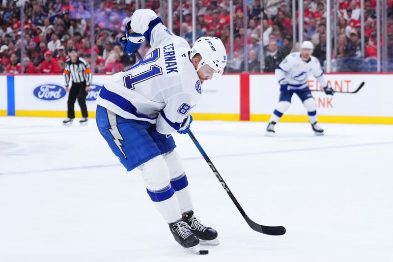 Apr 28, 2025; Sunrise, Florida, USA; Tampa Bay Lightning center Brayden Point (21) controls the puck against the Florida Panthers during the second period in game four of the first round of the 2025 Stanley Cup Playoffs at Amerant Bank Arena. Mandatory Credit: Rich Storry-Imagn Images
