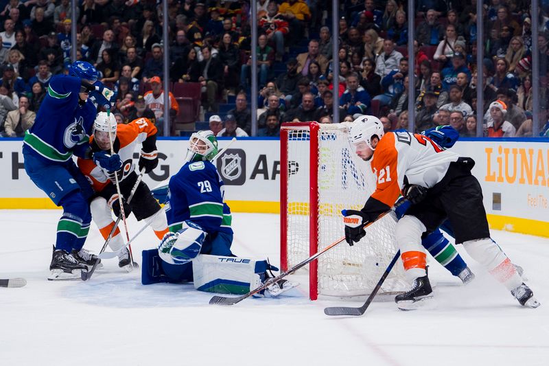 Dec 28, 2023; Vancouver, British Columbia, CAN; Vancouver Canucks goalie Casey DeSmith (29) makes a save on Philadelphia Flyers forward Scott Laughton (21) in the first period at Rogers Arena. Mandatory Credit: Bob Frid-USA TODAY Sports