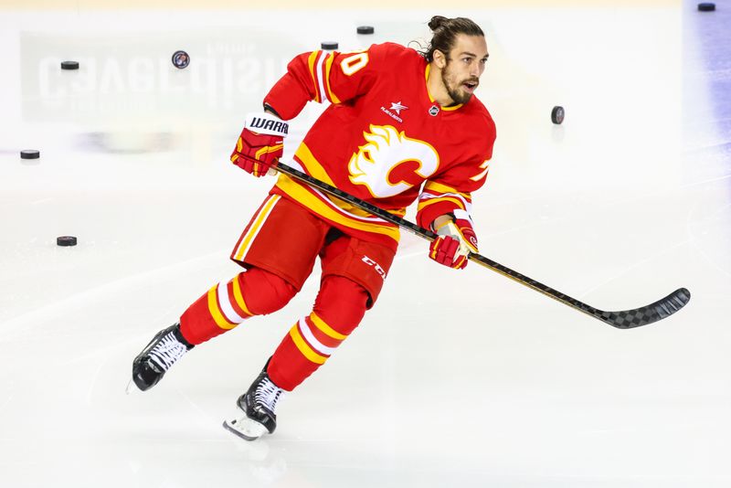 Nov 3, 2024; Calgary, Alberta, CAN; Calgary Flames left wing Ryan Lomberg (70) skates during the warmup period against the Edmonton Oilers at Scotiabank Saddledome. Mandatory Credit: Sergei Belski-Imagn Images