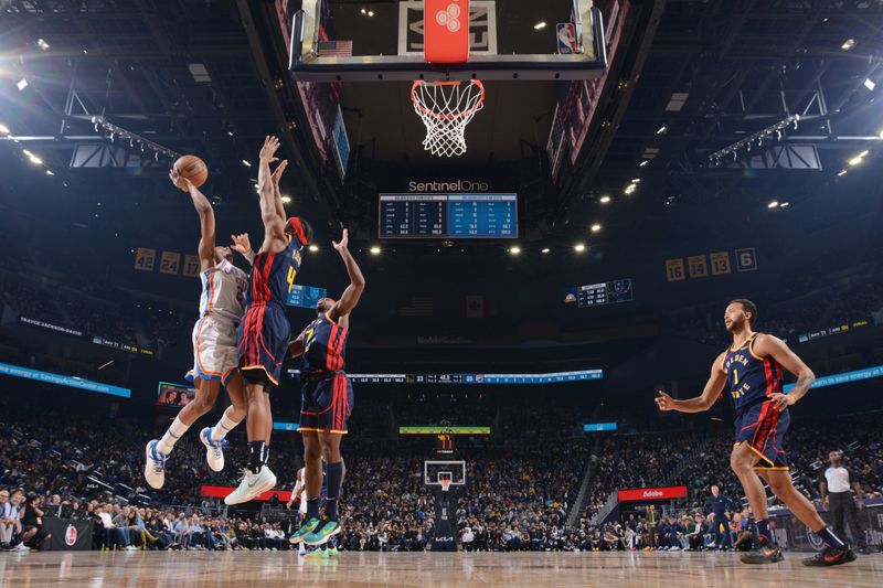 SAN FRANCISCO, CA - NOVEMBER 27: Shai Gilgeous-Alexander #2 of the Oklahoma City Thunder drives to the basket during the game against the Golden State Warriors on November 27, 2024 at Chase Center in San Francisco, California. NOTE TO USER: User expressly acknowledges and agrees that, by downloading and or using this photograph, user is consenting to the terms and conditions of Getty Images License Agreement. Mandatory Copyright Notice: Copyright 2024 NBAE (Photo by Noah Graham/NBAE via Getty Images)