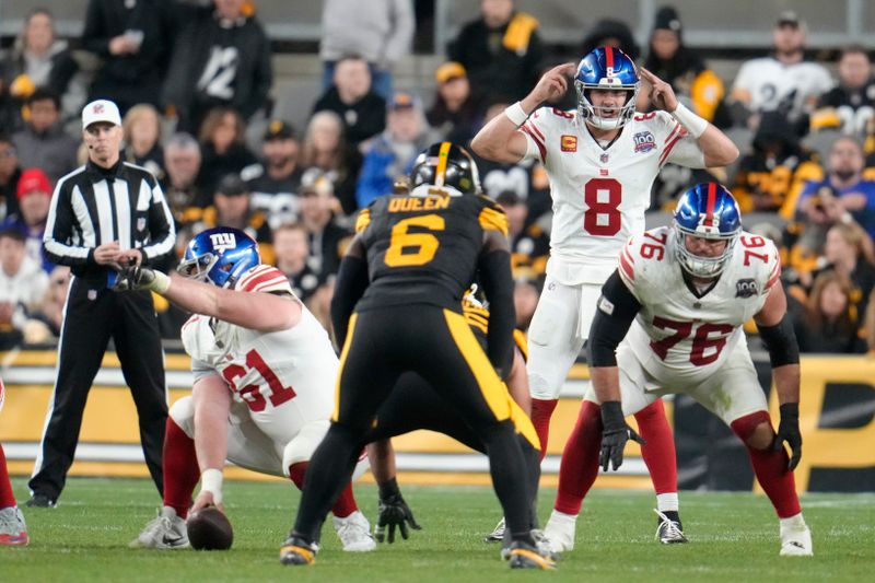 New York Giants quarterback Daniel Jones (8) calls a play during the second half of an NFL football game against the Pittsburgh Steelers, Monday, Oct. 28, 2024, in Pittsburgh. (AP Photo/Gene J. Puskar)