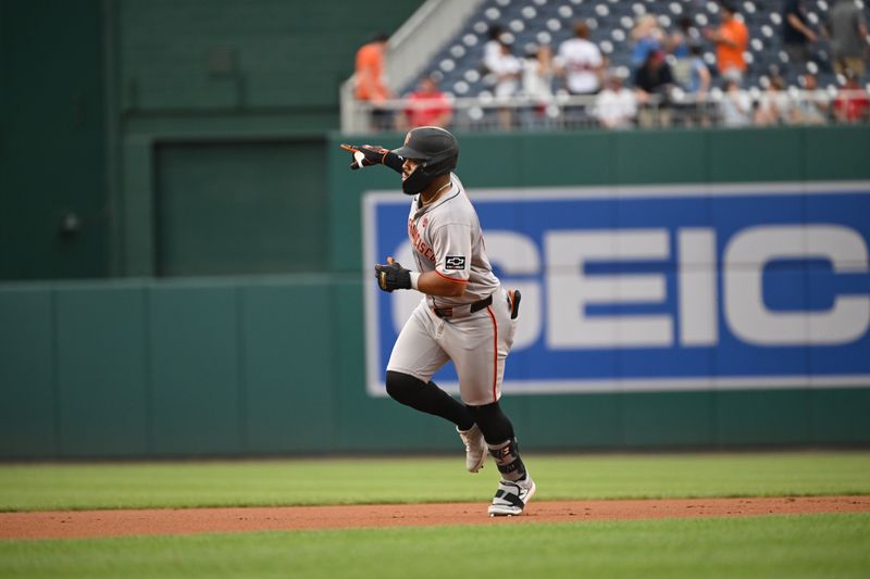 Aug 6, 2024; Washington, District of Columbia, USA; San Francisco Giants center fielder Heliot Ramos (17) gestures as he runs the bases after hitting a home run against the Washington Nationals during the first inning at Nationals Park. Mandatory Credit: Rafael Suanes-USA TODAY Sports