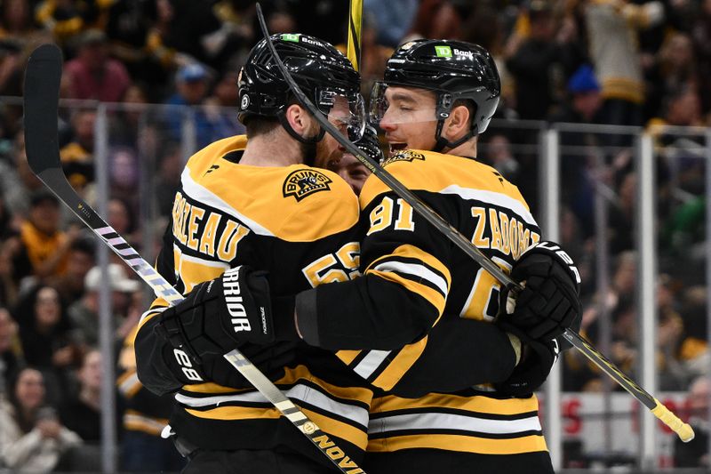 Nov 3, 2024; Boston, Massachusetts, USA; Boston Bruins right wing Justin Brazeau (55) celebrates with defenseman Nikita Zadorov (91) after scoring a goal against the Seattle Kraken during the first period at the TD Garden. Mandatory Credit: Brian Fluharty-Imagn Images