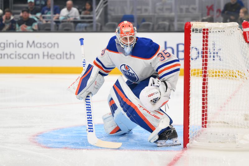 Oct 2, 2024; Seattle, Washington, USA; Edmonton Oilers goaltender Olivier Rodrigue (35) defends the goal during the first period against the Seattle Kraken at Climate Pledge Arena. Mandatory Credit: Steven Bisig-Imagn Images