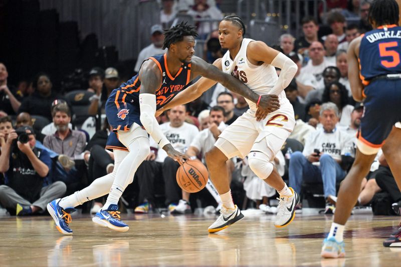 CLEVELAND, OHIO - APRIL 15: Julius Randle #30 of the New York Knicks drives to the basket around Isaac Okoro #35 of the Cleveland Cavaliers during the third quarter of Game One of the Eastern Conference First Round Playoffs at Rocket Mortgage Fieldhouse on April 15, 2023 in Cleveland, Ohio. The Knicks defeated the Cavaliers 101-97. NOTE TO USER: User expressly acknowledges and agrees that, by downloading and or using this photograph, User is consenting to the terms and conditions of the Getty Images License Agreement. (Photo by Jason Miller/Getty Images)