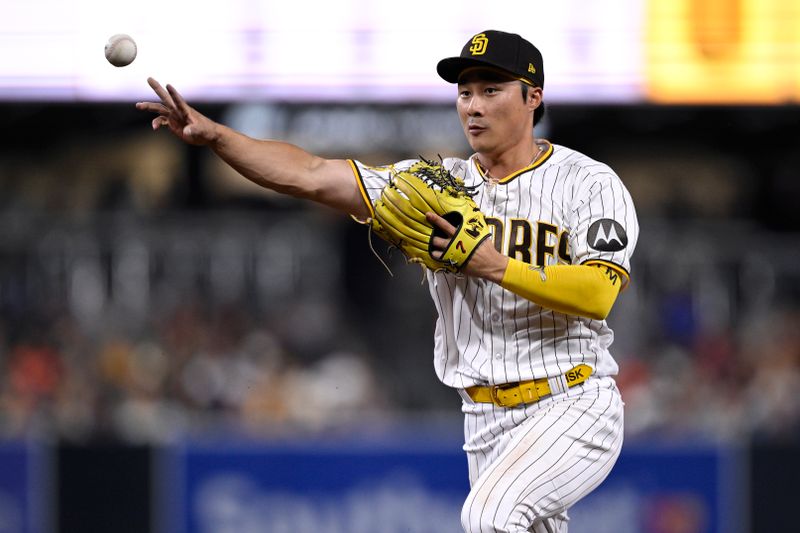 Aug 15, 2023; San Diego, California, USA; San Diego Padres second baseman Ha-seong Kim (7) throws to first base on a ground out by Baltimore Orioles shortstop Gunnar Henderson (not pictured) during the fifth inning at Petco Park. Mandatory Credit: Orlando Ramirez-USA TODAY Sports