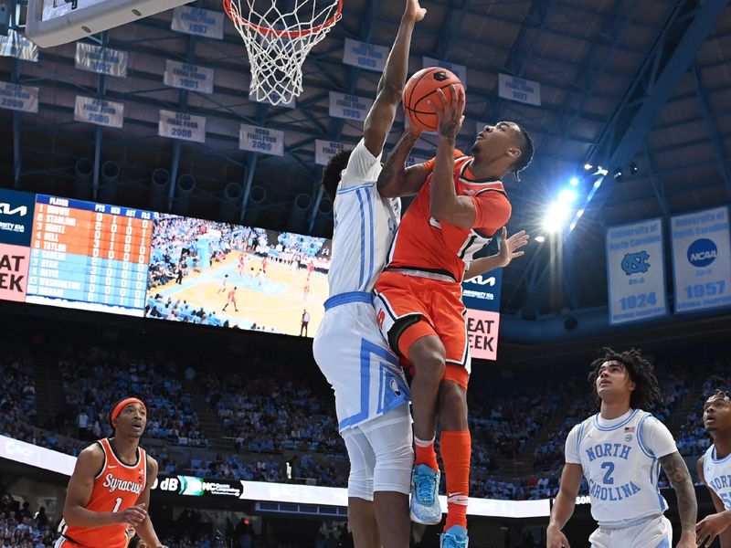 Jan 13, 2024; Chapel Hill, North Carolina, USA;  Syracuse Orange guard JJ Starling (2) shoots as North Carolina Tar Heels forward Jalen Washington (13) defends in the first half at Dean E. Smith Center. Mandatory Credit: Bob Donnan-USA TODAY Sports