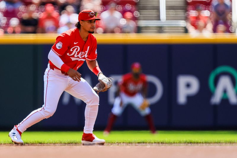 Sep 19, 2024; Cincinnati, Ohio, USA; Cincinnati Reds second baseman Santiago Espinal (4) prepares for the pitch in the first inning against the Atlanta Braves at Great American Ball Park. Mandatory Credit: Katie Stratman-Imagn Images