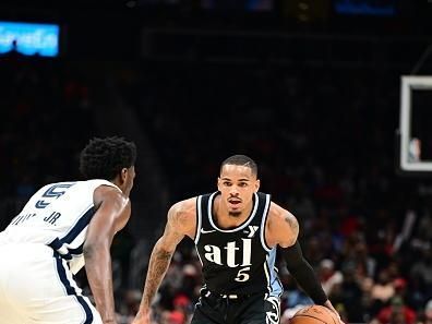 ATLANTA, GA - DECEMBER 23: Dejounte Murray #5 of the Atlanta Hawks dribbles the ball during the game against the Memphis Grizzlies on December 23, 2023 at State Farm Arena in Atlanta, Georgia.  NOTE TO USER: User expressly acknowledges and agrees that, by downloading and/or using this Photograph, user is consenting to the terms and conditions of the Getty Images License Agreement. Mandatory Copyright Notice: Copyright 2023 NBAE (Photo by Adam Hagy/NBAE via Getty Images)