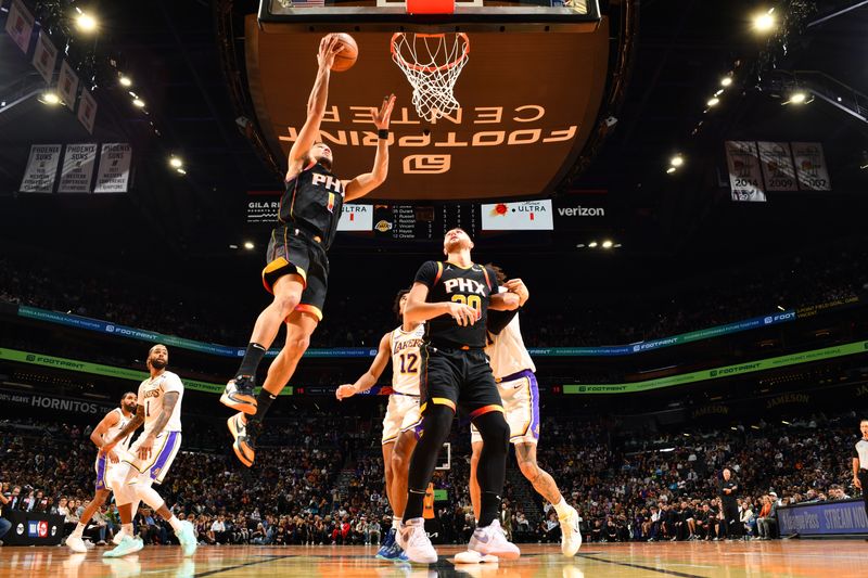 PHOENIX, AZ - NOVEMBER 26: Devin Booker #1 of the Phoenix Suns drives to the basket during the game against the Los Angeles Lakers during the Emirates NBA Cup game on November 26, 2024 at Footprint Center in Phoenix, Arizona. NOTE TO USER: User expressly acknowledges and agrees that, by downloading and or using this photograph, user is consenting to the terms and conditions of the Getty Images License Agreement. Mandatory Copyright Notice: Copyright 2024 NBAE (Photo by Barry Gossage/NBAE via Getty Images)