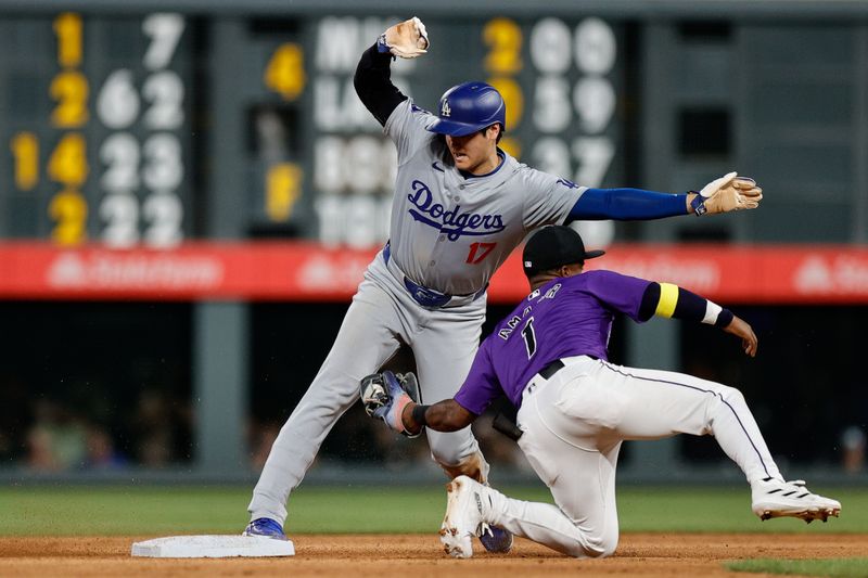 Jun 17, 2024; Denver, Colorado, USA; Los Angeles Dodgers designated hitter Shohei Ohtani (17) safely steals second against Colorado Rockies second baseman Adael Amador (1) in the eighth inning at Coors Field. Mandatory Credit: Isaiah J. Downing-USA TODAY Sports