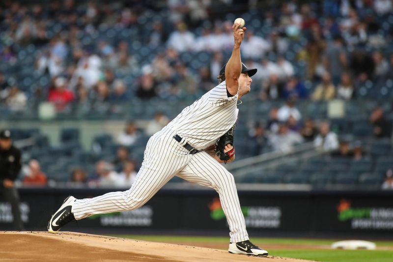 Apr 13, 2022; Bronx, New York, USA;  New York Yankees starting pitcher Gerrit Cole (45) pitches in the first inning against the Toronto Blue Jays at Yankee Stadium. Mandatory Credit: Wendell Cruz-USA TODAY Sports