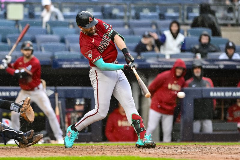 Sep 24, 2023; Bronx, New York, USA; Arizona Diamondbacks third baseman Evan Longoria (3) hits a two RBI single against the New York Yankees during the seventh inning at Yankee Stadium. Mandatory Credit: John Jones-USA TODAY Sports