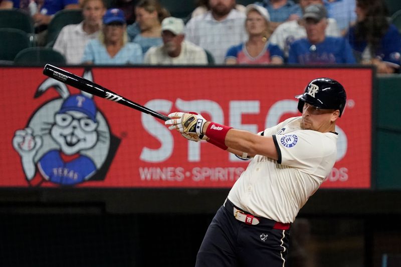Jul 5, 2024; Arlington, Texas, USA; Texas Rangers first baseman Nathaniel Lowe (30) hits an RBI single during the third inning against the Tampa Bay Rays at Globe Life Field. Mandatory Credit: Raymond Carlin III-USA TODAY Sports