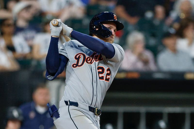 Jun 2, 2025; Chicago, Illinois, USA; Detroit Tigers center fielder Parker Meadows (22) hits a triple against the Chicago White Sox during the sixth inning at Rate Field. Mandatory Credit: Kamil Krzaczynski-Imagn Images