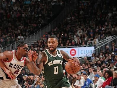 MILWAUKEE, WI - NOVEMBER 26: Damian Lillard #0 of the Milwaukee Bucks dribbles the ball during the game against the Portland Trail Blazers on November 26, 2023 at the Fiserv Forum Center in Milwaukee, Wisconsin. NOTE TO USER: User expressly acknowledges and agrees that, by downloading and or using this Photograph, user is consenting to the terms and conditions of the Getty Images License Agreement. Mandatory Copyright Notice: Copyright 2023 NBAE (Photo by Gary Dineen/NBAE via Getty Images).