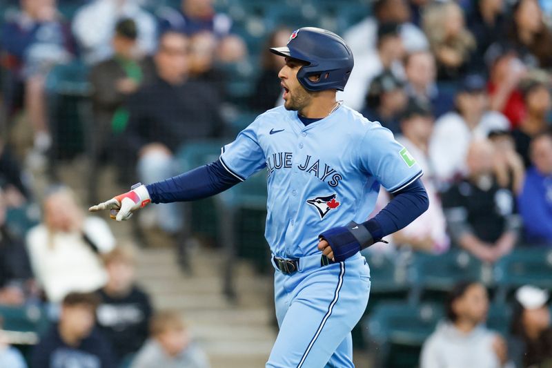 May 27, 2024; Chicago, Illinois, USA; Toronto Blue Jays outfielder George Springer (4) reacts after scoring against the Chicago White Sox during the fourth inning at Guaranteed Rate Field. Mandatory Credit: Kamil Krzaczynski-USA TODAY Sports