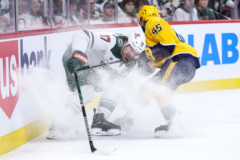 Nov 30, 2024; Saint Paul, Minnesota, USA; Minnesota Wild left wing Marcus Foligno (17) and Nashville Predators defenseman Alexandre Carrier (45) compete for the puck during the second period at Xcel Energy Center. Mandatory Credit: Matt Krohn-Imagn Images