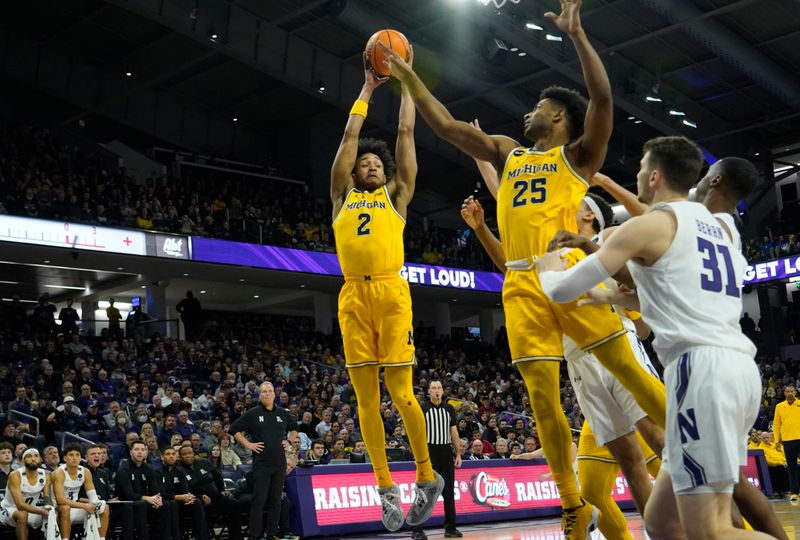 Feb 2, 2023; Evanston, Illinois, USA; Michigan Wolverines guard Kobe Bufkin (2) grabs a rebound against the Northwestern Wildcats during the first half at Welsh-Ryan Arena. Mandatory Credit: David Banks-USA TODAY Sports