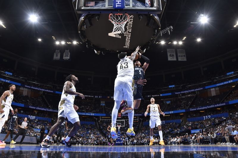 ORLANDO, FL - OCTOBER 28: Paolo Banchero #5 of the Orlando Magic shoots the ball during the game against the Indiana Pacers on October 28, 2024 at Kia Center in Orlando, Florida. NOTE TO USER: User expressly acknowledges and agrees that, by downloading and or using this photograph, User is consenting to the terms and conditions of the Getty Images License Agreement. Mandatory Copyright Notice: Copyright 2024 NBAE (Photo by Fernando Medina/NBAE via Getty Images)