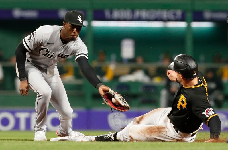 Apr 8, 2023; Pittsburgh, Pennsylvania, USA;  Pittsburgh Pirates left fielder Bryan Reynolds (10) steals second base ahead of the tag attempt of Chicago White Sox shortstop Tim Anderson (7) during the fifth inning at PNC Park. Mandatory Credit: Charles LeClaire-USA TODAY Sports