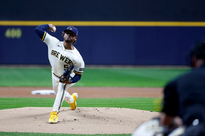 Oct 4, 2023; Milwaukee, Wisconsin, USA; Milwaukee Brewers starting pitcher Freddy Peralta (51) pitches in the first inning against the Arizona Diamondbacks during game two of the Wildcard series for the 2023 MLB playoffs at American Family Field. Mandatory Credit: Kamil Krzaczynski-USA TODAY Sports